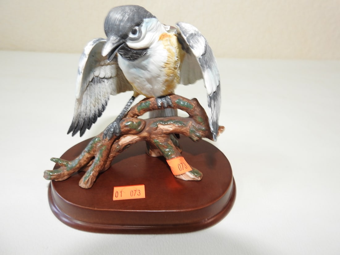 Goto Original Japanese Porcelain Bird Figurine: Goto Original Japanese hand-painted porcelain bird figurine on wood base. Approx. 5 x 5 x 3.5 in.