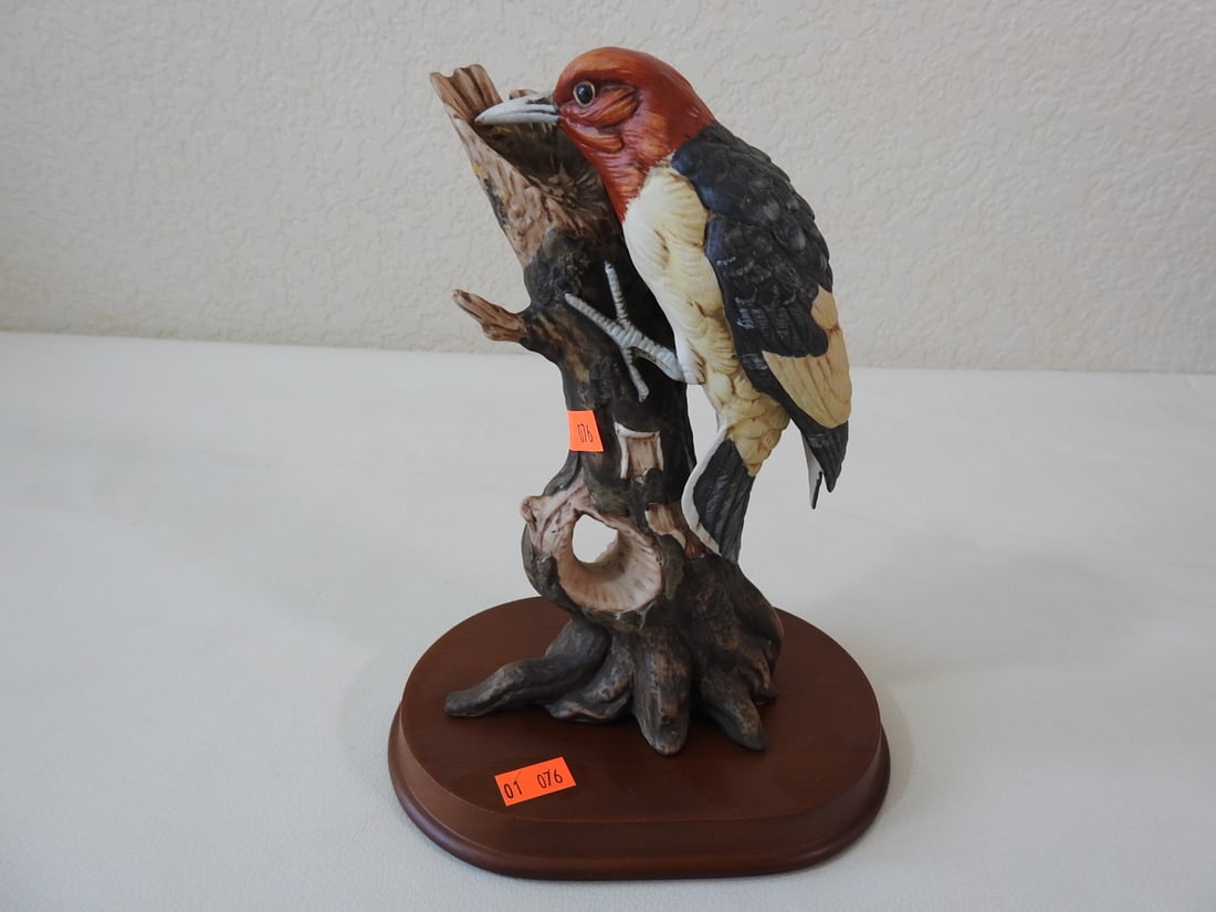 Goto Original Japanese Porcelain Woodpecker Figurine: Goto Original Japanese hand-painted porcelain woodpecker figurine on wood base. Approx. 9 x 5.5 x 4 in.