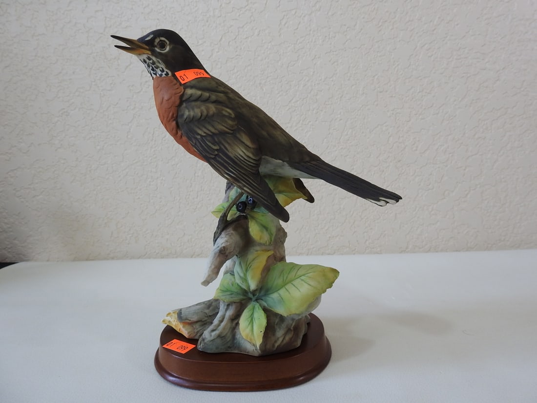 J. Tagliariol Porcelain Robin Bird Figurine: Vintage porcelain red-breasted robin bird figurine signed by J. Tagliariol. Approx. 8.75 x 7 x 4.75 in.