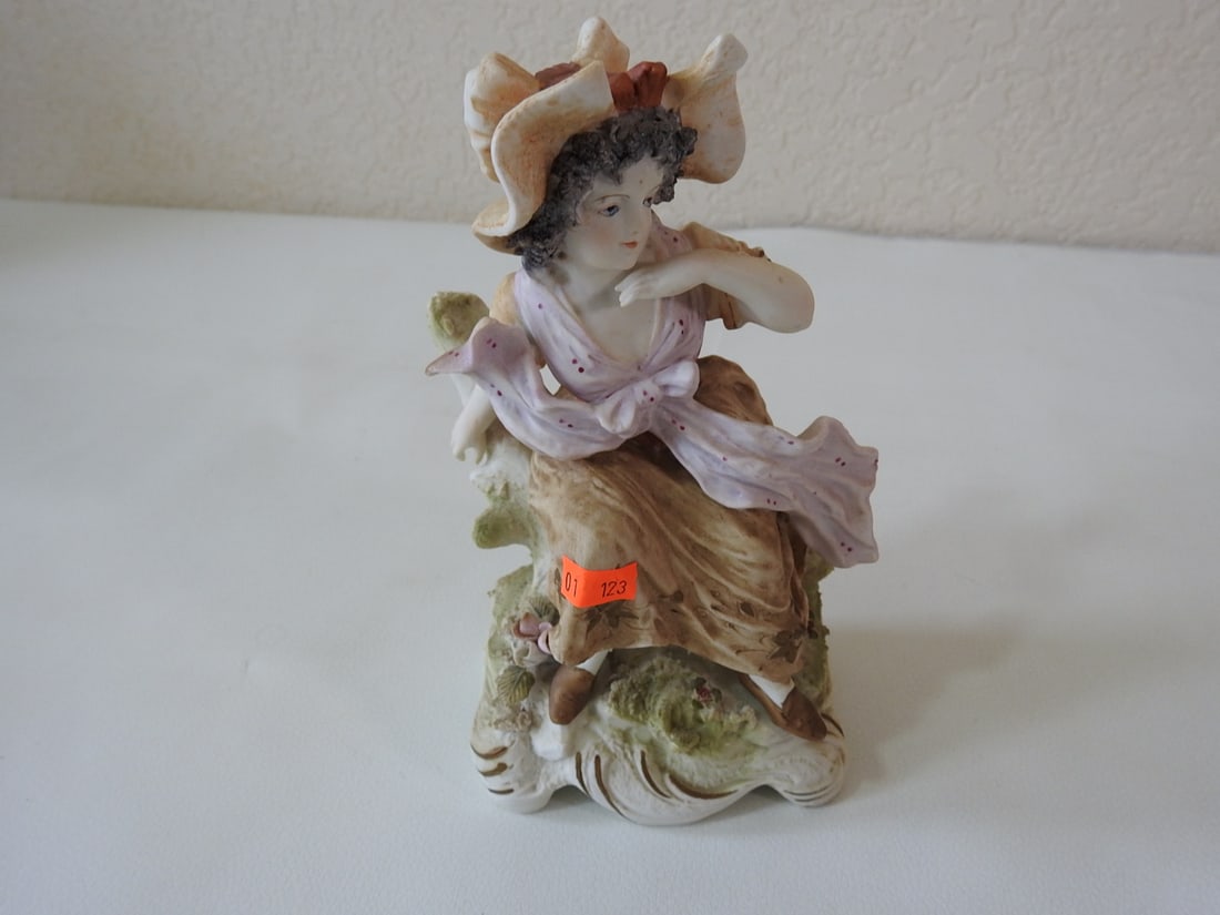 Vintage French Village Lady Porcelain Figurine: Vintage French village lady porcelain/bisque figurine, Japan. Approx. 7.5 x 4.5 x 3 in.