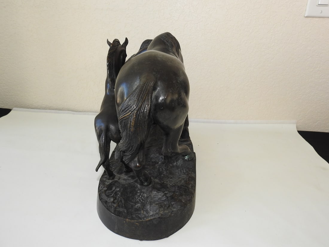 Bronze Mare and Colt Statue: Solid hollow bronze statue depicting a mare and colt, made in Vietnam. Approx. 11.5 x 17 x 8 in.