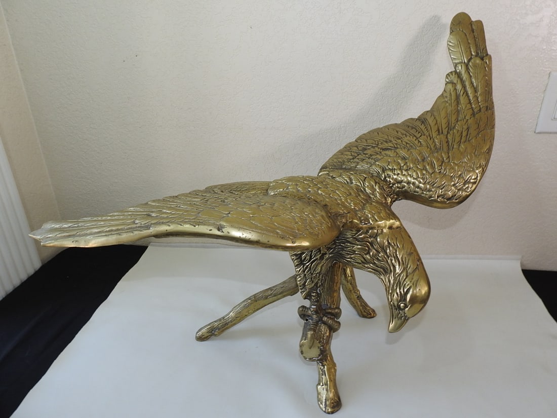 Large Solid Brass American Eagle Statue: Large hollow solid brass American eagle statue with spread-wing display form. Approx. 22.5 x 32 x 17 in.