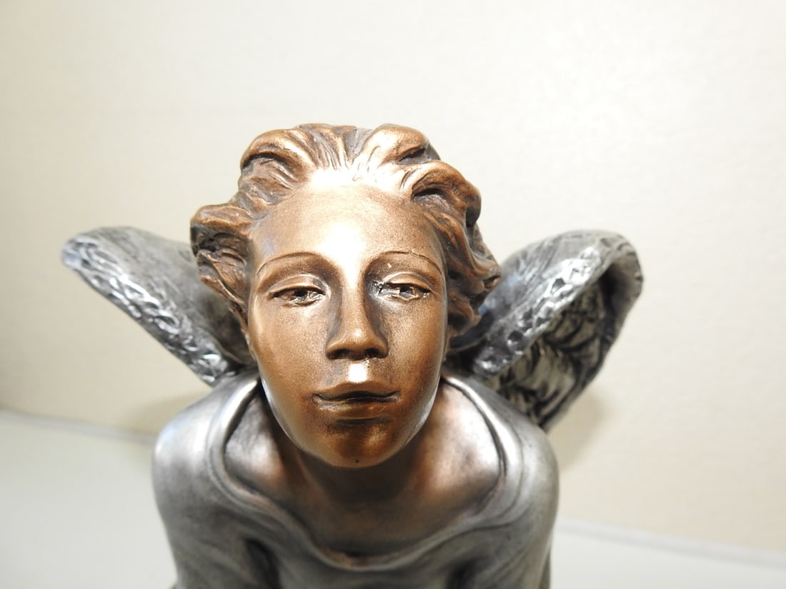 Alice Heath “Guardian Angel?? Austin Productions Statue: Faux bronze “Guardian Angel” statue signed Alice Heath and manufactured by Austin Productions. Approx. 12 x 9.5 x 11 in.