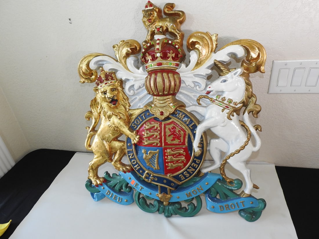 Large Royal Coat of Arms of the United Kingdom Wall Decor: Large hand-painted metal Royal Coat of Arms of the United Kingdom wall decor. Very heavy display piece. Approx. 29 x 25 x 3 in.