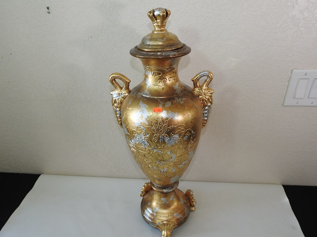Gold and Silver Leaf Classical Ceramic Urn: Classical style ceramic urn with gold and silver leaf finish and three-footed base. Approx. 26 x 11 x 9 in.