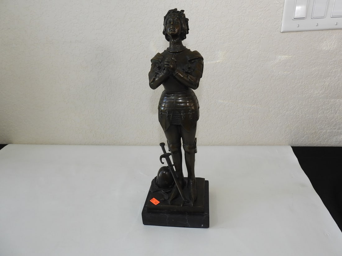 Joan of Arc Bronze Statue on Marble Base: Bronze Joan of Arc statue on black marble base, signed Noee. Approx. 16.5 x 5.5 x 4.5 in.