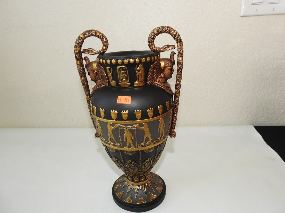 Neoclassical Egyptian Resin Urn with Snake Handles: Neoclassical Egyptian-style black resin urn with gold gilt hieroglyphic decoration and applied snake handles. Approx. 12.5 x 7 x 6.5 in.