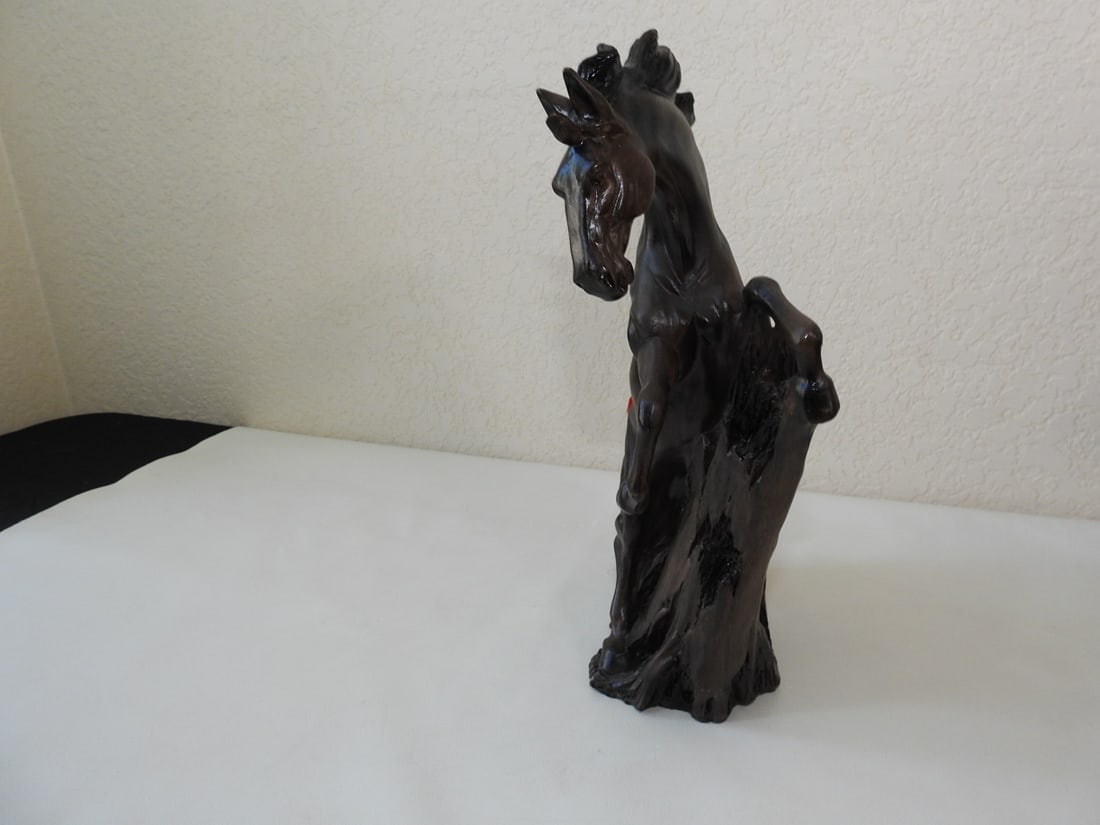 Faux Wood Carved Horse Statue: Horse statue with faux wood carved appearance, made of resin. Approx. 13.5 x 10 x 5 in.