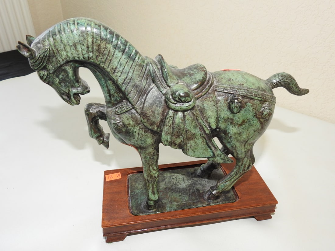 Chinese Solid Bronze Horse Statue on Wood Base: Solid bronze Chinese horse statue with fitted wooden base. Approx. 9.75 x 11 x 3.75 in.