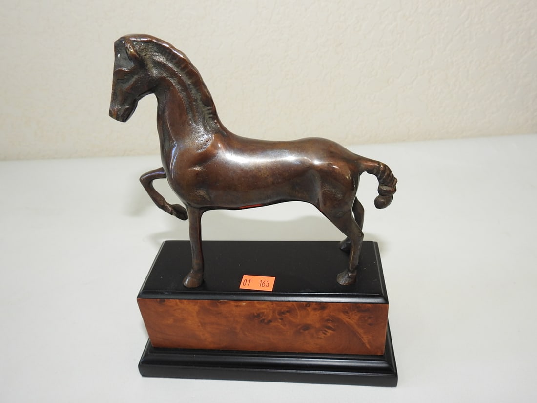 Solid Bronze Trophy Horse Statue on Birdseye Maple Base: Solid bronze trophy horse statue mounted on birdseye maple wooden base. Approx. 8.5 x 6.5 x 3 in.