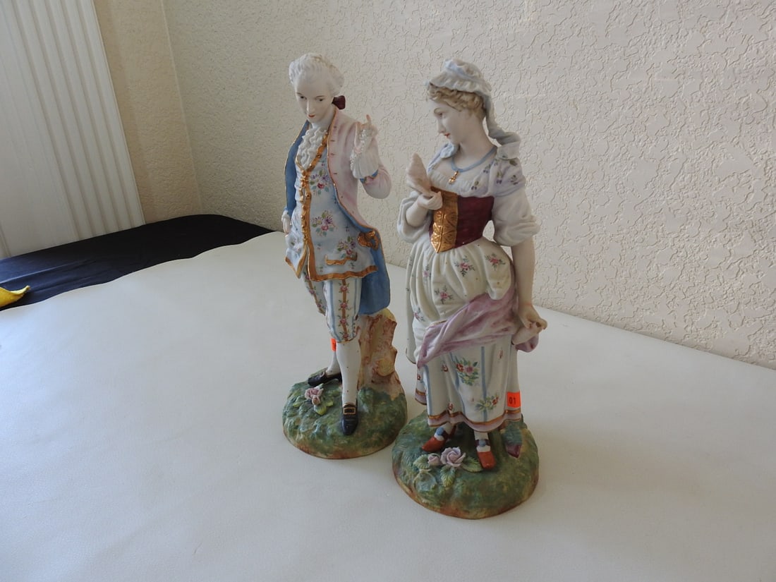 Andrea by Sadek French Village Couple Bisque Figurine: Andrea by Sadek hand-painted bisque French village couple figurine, series #M681. One ribbon is broken and reglued; see photos. Approx. 12 x 9.5 x 5 in.