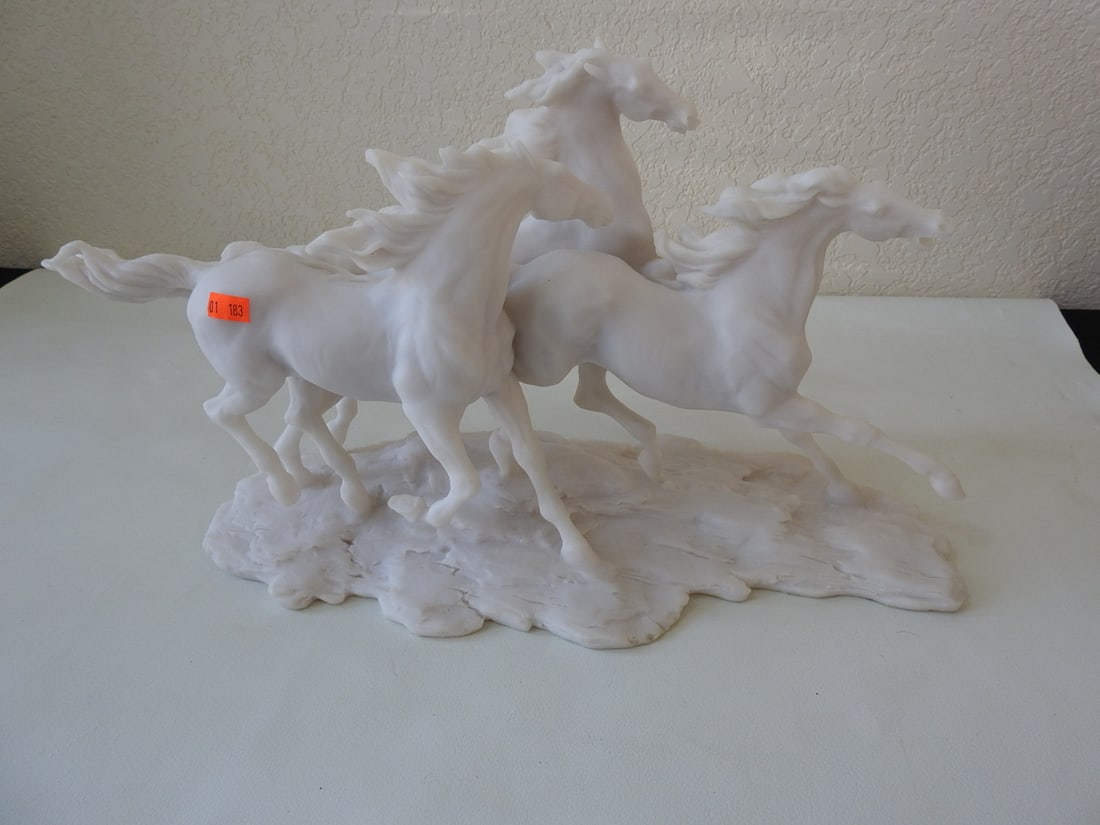 Running Wild Horses Faux Marble Statue: Running wild horses statue made of resin with faux marble finish. Approx. 10 x 18 x 8 in.