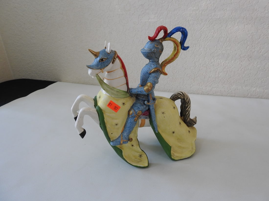 Vintage Porcelain Jousting Rider with Lance: Vintage hand-painted soft porcelain jousting rider with lance and 24K gold accents. Approx. 12.75 x 10 x 3.75 in.