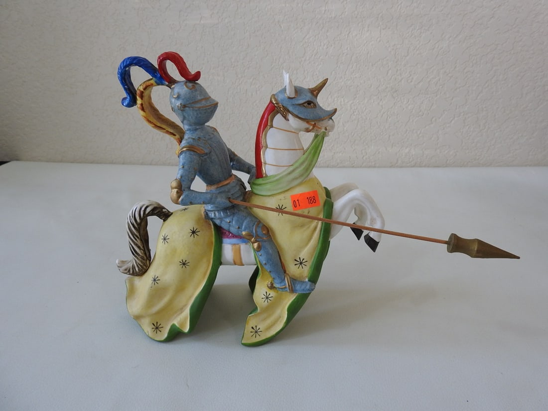 Vintage Porcelain Jousting Rider with Lance: Vintage hand-painted soft porcelain jousting rider with lance and 24K gold accents. Minor paint chipping noted; see photos. Approx. 9 x 12 x 3.25 in.