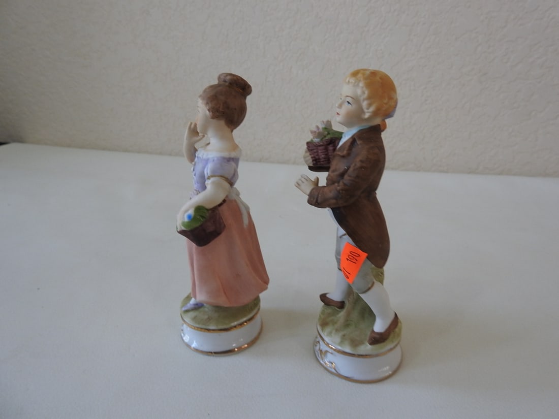 Vintage French Village Couple Bisque Porcelain Figurine: Vintage hand-painted Japan bisque porcelain French village couple figurine with gold gilt accents. Petals are broken from the flowers; see photos. Approx. 6.5 x 5 x 5 in.