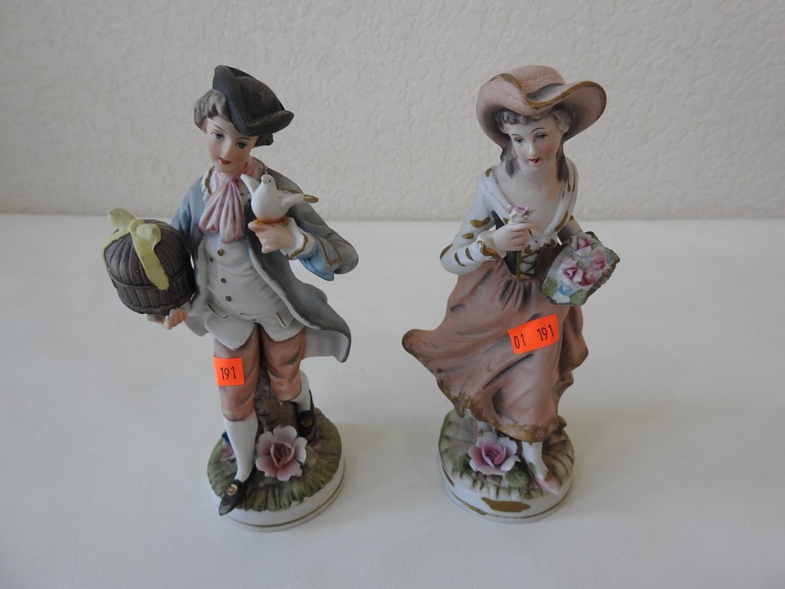 Vintage French Village Couple Bisque Porcelain Figurine: Vintage hand-painted Japan bisque porcelain French village couple figurine with gold accents. Male figure shows signs of repair; see photos. Approx. 8 x 5.75 x 3.5 in.