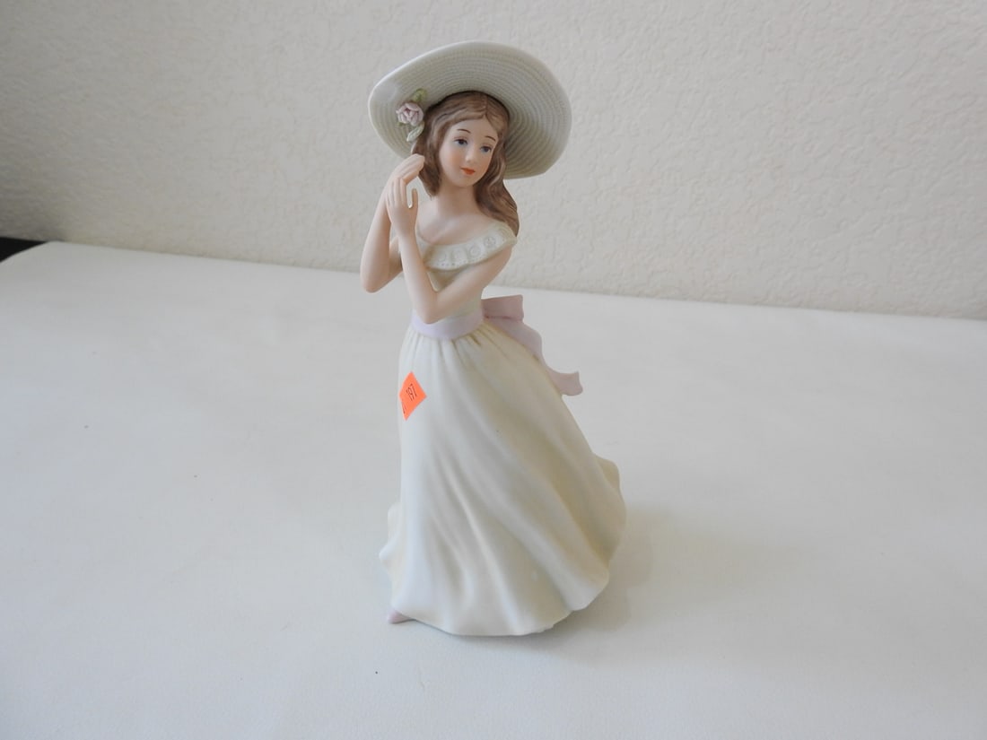 Koji Mizuno “Melanie?? Victorian Lady Figurine: Vintage Victorian lady porcelain figurine titled “Melanie, ” signed by master ceramicist Koji Mizuno, 1996, made for Home Interiors and Gifts. Minimal white chips noted; see photos. Approx.