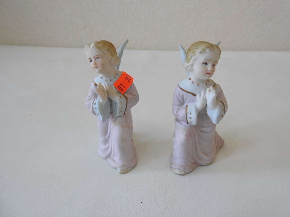 Vintage Japan Bisque Angel Figurines Set of 2: Set of two vintage Japan bisque angel figurines. One angel shows signs of seamless repair; measured as a set. Approx. 4 x 5 x 3 in.