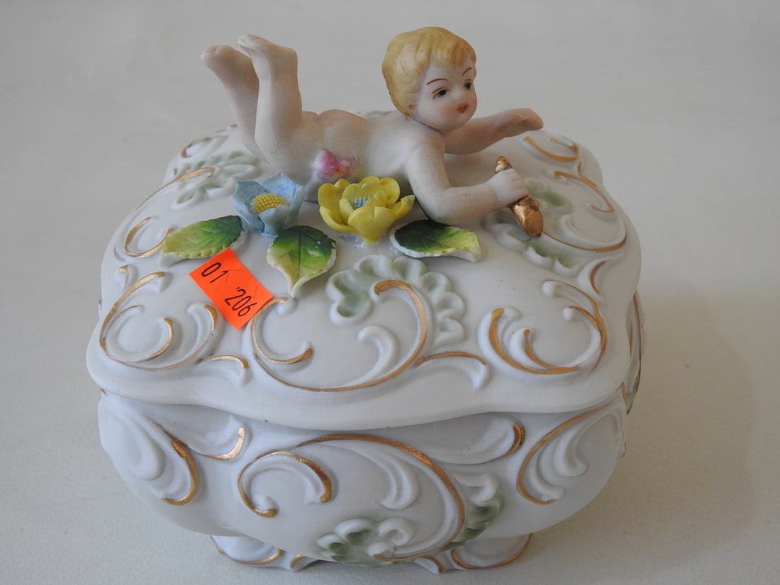 Kelvin’s Japan Victorian Cherub Candy Dish: Vintage Kelvin’s Japan bisque Victorian cherub candy dish with gold accents and applied leaves and flowers. Approx. 5.5 x 5.75 x 5.5 in.