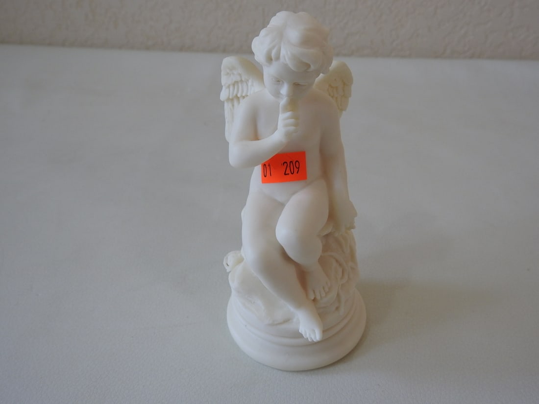 Vivian C. Cupid Resin Figurine: Vintage Cupid resin figurine by Vivian C., #209, made in Italy. Approx. 6 x 3.75 x 3.75 in.