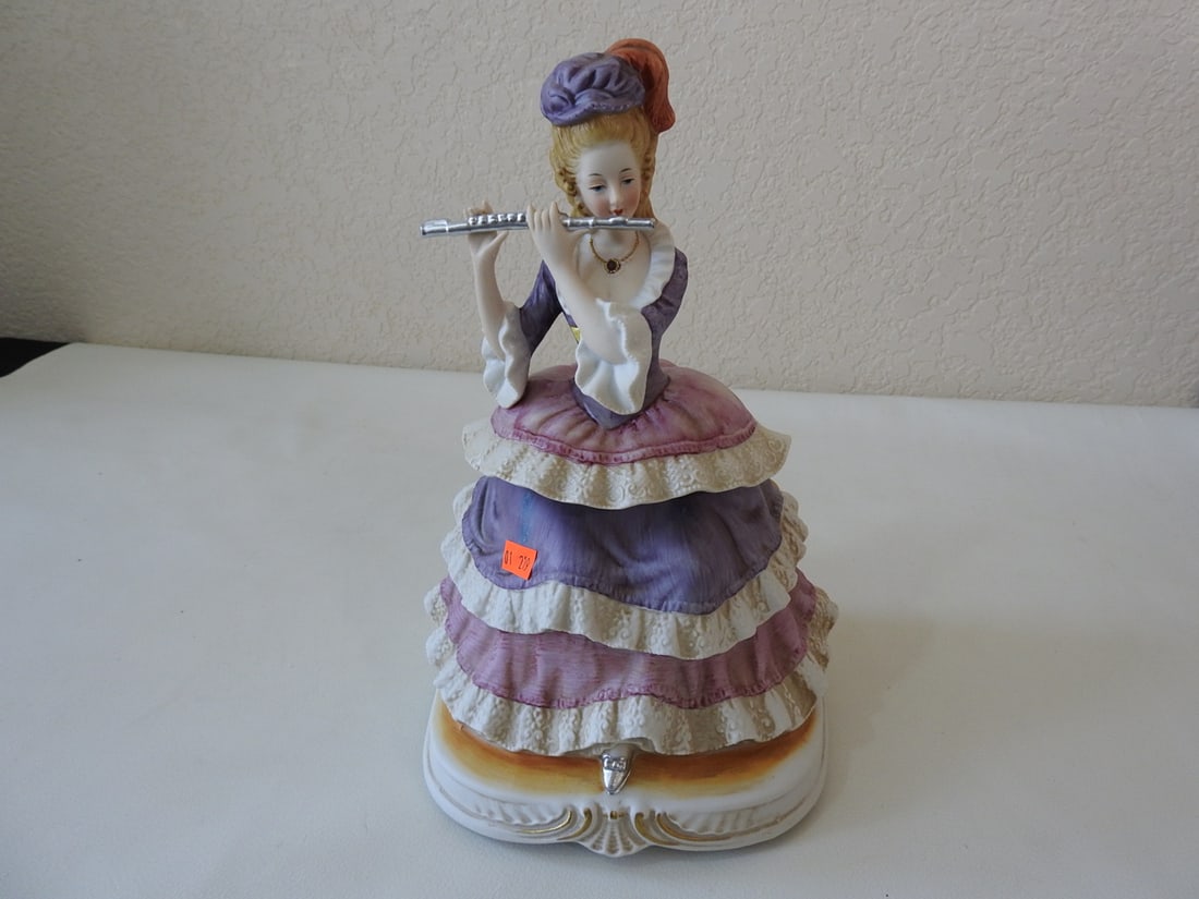 Vintage French Aristocrat Flute Player Music Box: Vintage French aristocrat flute player music box with gold gilt necklace. Figurine is in good condition; music box untested. Approx. 11 x 6.75 x 6.5 in.