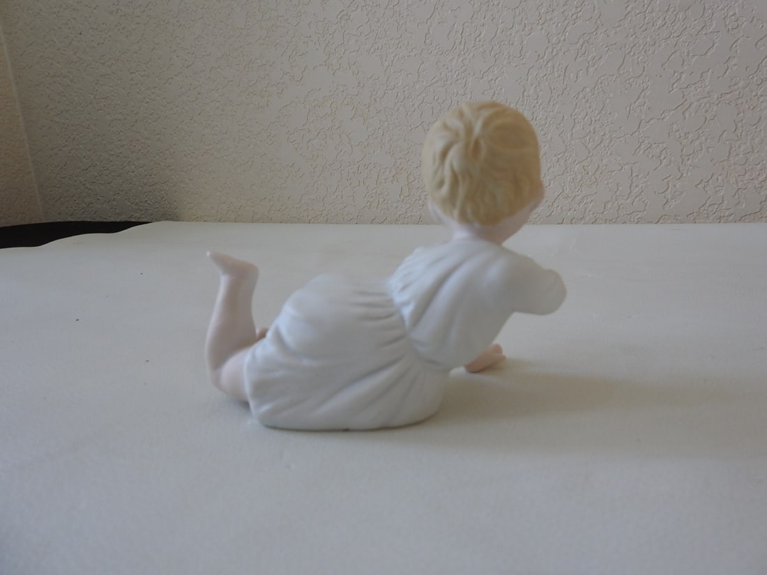Vintage Japan Bisque Piano Baby Figurine: Vintage Japan bisque piano baby figurine, serial 23/115. Approx. 4 x 5 x 3 in.