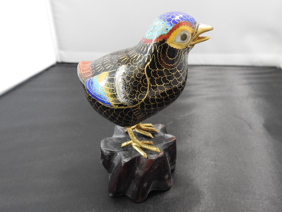 Chinese Cloisonne Bird on Wood Base: Chinese cloisonne bird with brass base metal and wooden base. Approx. 3 x 3 x 2 in.