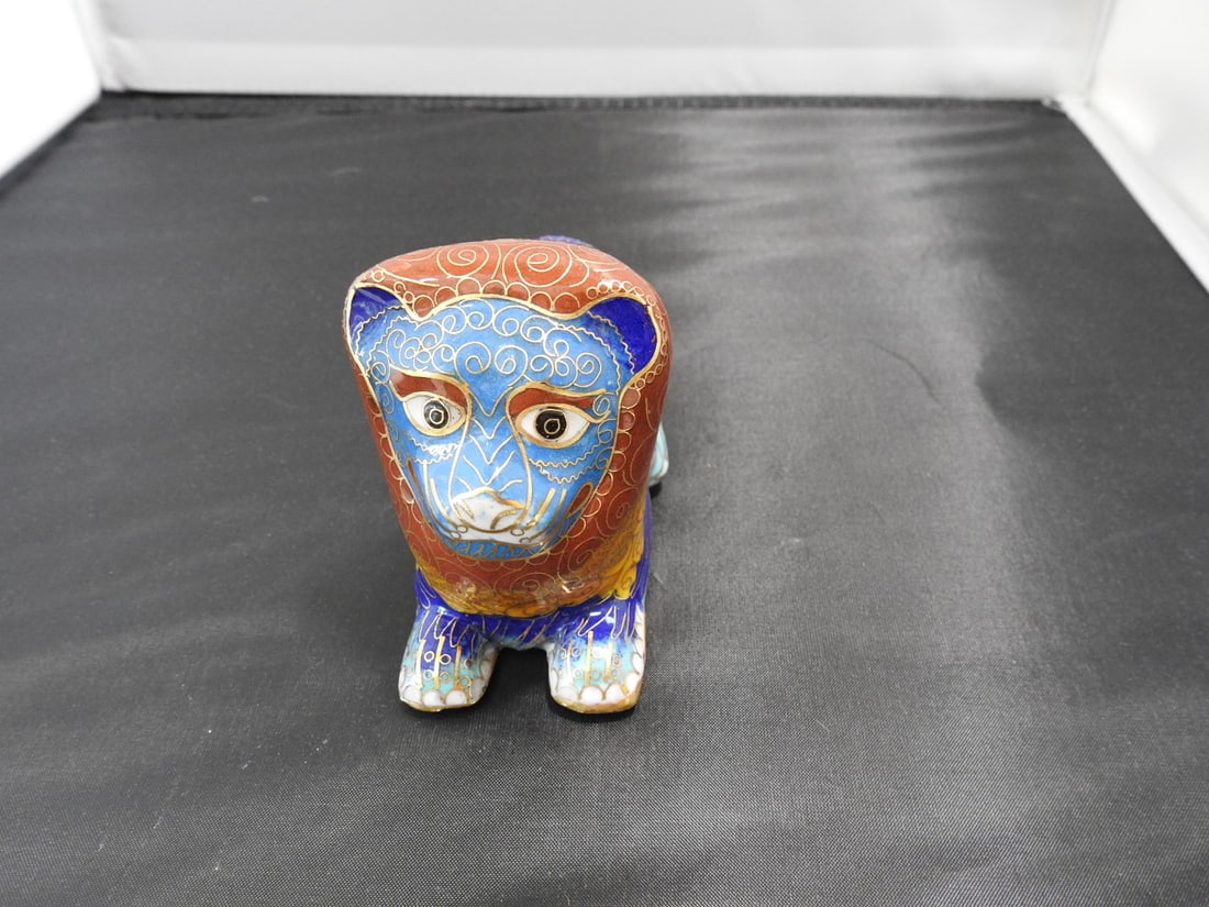 Chinese Cloisonne Lion Figure: Chinese cloisonne lion figure with brass base metal. Approx. 3 x 2.5 x 5 in.