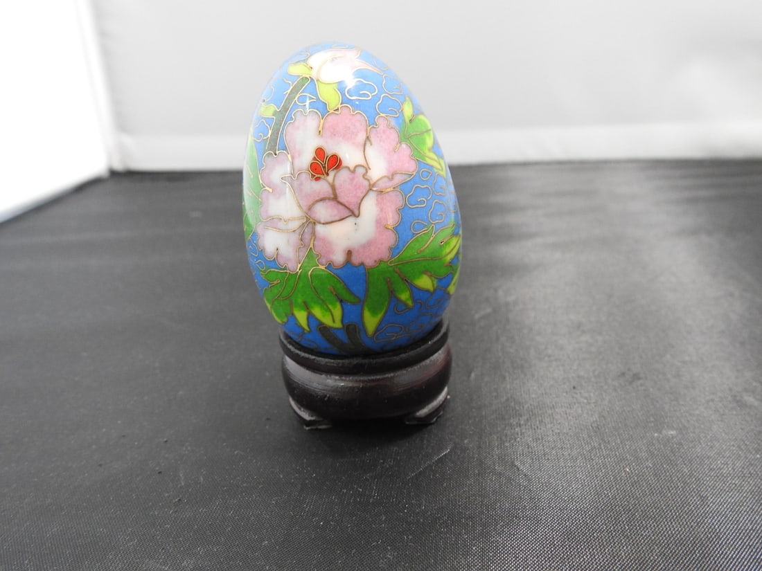 Vintage Chinese Cloisonne Egg on Wood Base: Vintage Chinese cloisonne egg with gilt finish and custom fitted wooden base. Approx. 3.5 x 2 x 2 in.