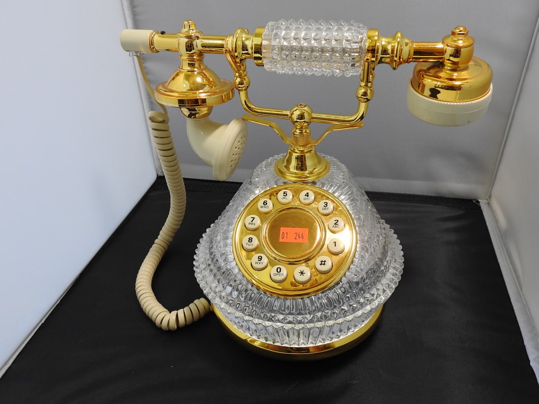 Vintage Reproduction Lead Crystal Old Style Telephone: Vintage reproduction old style telephone in lead crystal with gold tone finish. Approx. 9.25 x 10.75 x 7 in.