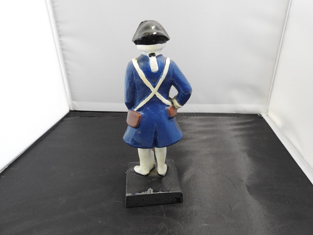 Blue Cast Metal French Revolutionary Soldier Figure: Blue hand-painted cast metal French Revolutionary soldier figure with paint chipping noted. Approx. 7.5 x 3 x 2.5 in.