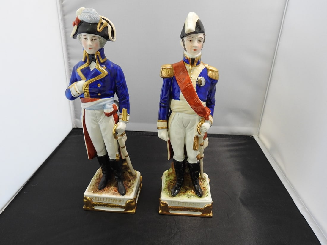 Scheibe-Alsbach Bertrand and Kellerman Porcelain Figure: Scheibe-Alsbach German porcelain figure depicting Bertrand and Kellerman, hand-painted with 24K gold and cobalt blue accents, serial #12753. Approx. 10 x 3 x 5.5 in.