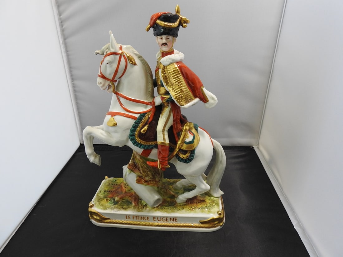 Scheibe-Alsbach “Le Prince Eugene?? Porcelain Figure: Scheibe-Alsbach hand-painted porcelain figure titled “Le Prince Eugene” with gold gilt accents. Approx. 11.5 x 3.5 x 8.5 in.