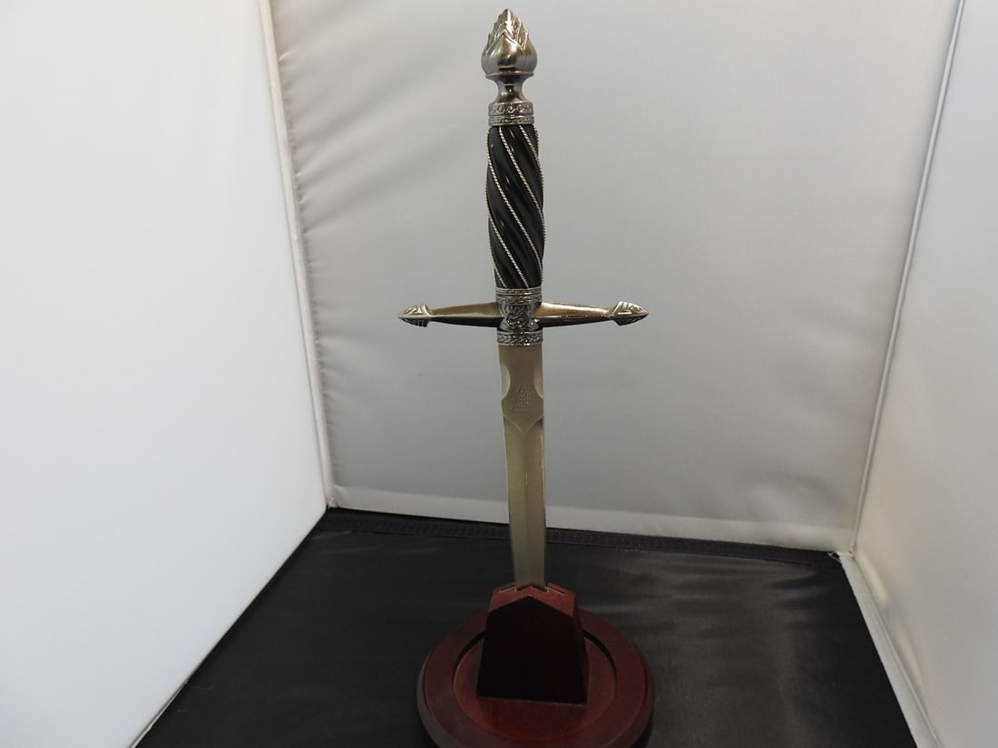 United Cutlery “Legends in Steel” Round Table Dagger: United Cutlery “Legends in Steel” Round Table dagger, serial number UC969, with resin handle and gunmetal finish. Approx. 14 x 5 x 5 in.