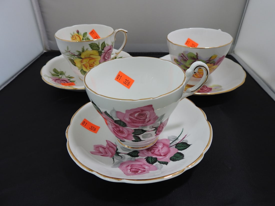 Set of 3 Vintage Bone China Teacup and Saucers: Set of three vintage bone china teacups and saucers with matching patterns; see photos for individual designs. Measured as packed. Approx. 10 x 6 x 6 in.