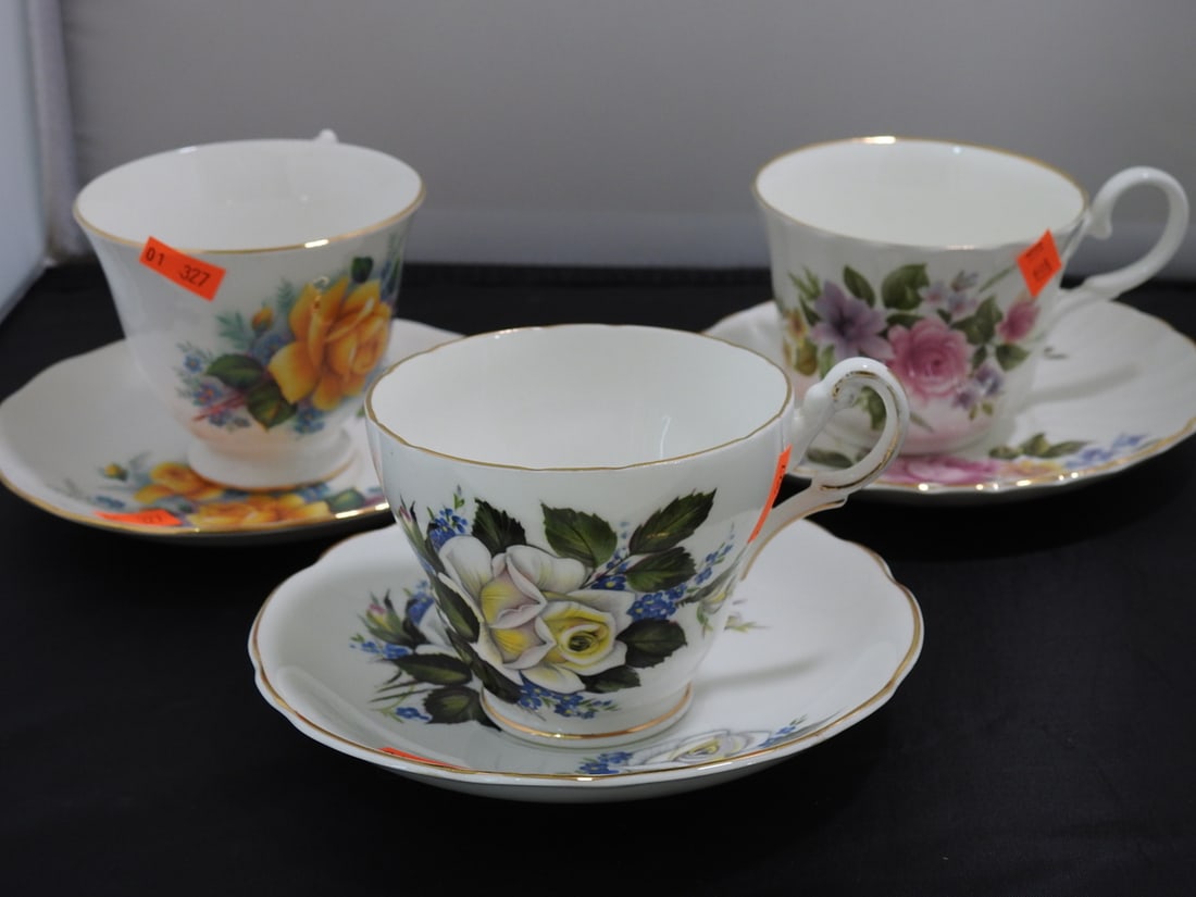 Set of 3 Vintage Bone China Teacup and Saucers: Set of three vintage bone china teacups and saucers with matching patterns; see photos for individual designs. Measured as packed. Approx. 10 x 6 x 6 in.