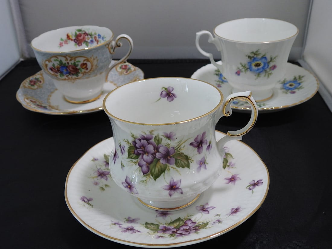 Set of 3 Vintage Bone China Teacup and Saucers: Set of three vintage bone china teacups and saucers with matching patterns; see photos for individual designs. Measured as packed. Approx. 10 x 6 x 6 in.