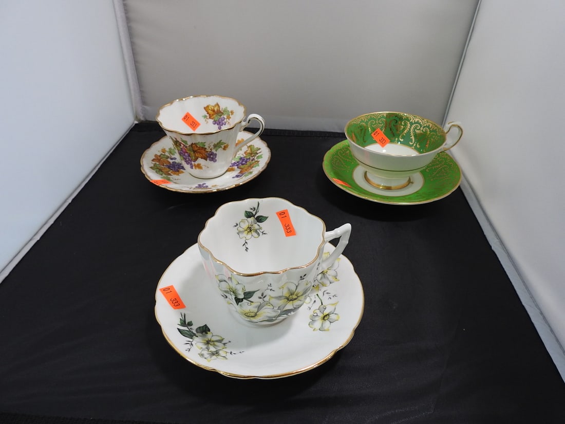 Set of 3 Vintage Bone China Teacup and Saucers: Set of three vintage bone china teacups and saucers with matching patterns; see photos for individual designs. Measured as packed. Approx. 10 x 6 x 6 in.