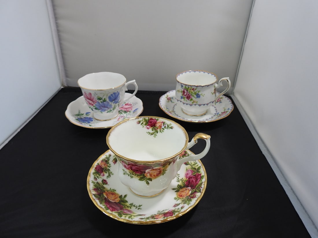 Set of 3 Vintage Bone China Teacup and Saucers: Set of three vintage bone china teacups and saucers with matching patterns; see photos for individual designs. Measured as packed. Approx. 10 x 6 x 6 in.