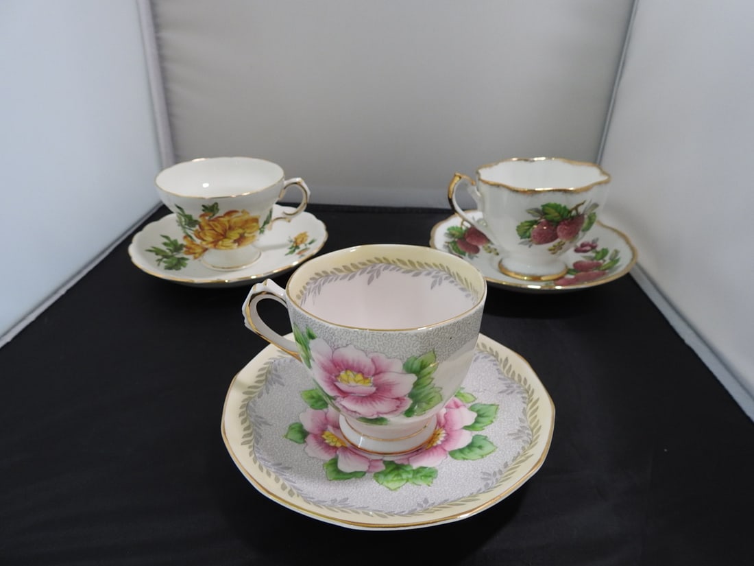 Set of 3 Vintage Bone China Teacup and Saucers: Set of three vintage bone china teacups and saucers with matching patterns; see photos for individual designs. Measured as packed. Approx. 10 x 6 x 6 in.