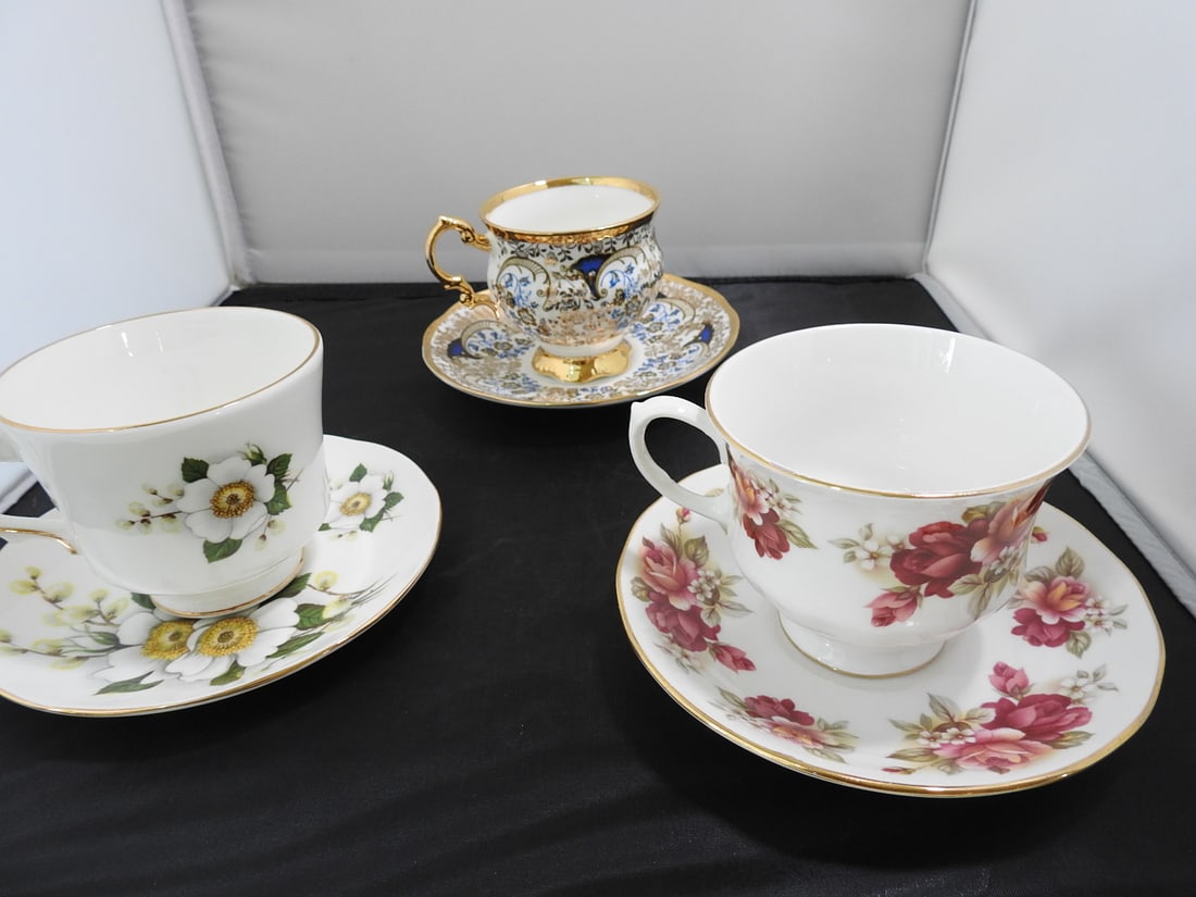 Set of 3 Vintage Bone China Teacup and Saucers: Set of three vintage bone china teacups and saucers with matching patterns; see photos for individual designs. Measured as packed. Approx. 10 x 6 x 6 in.