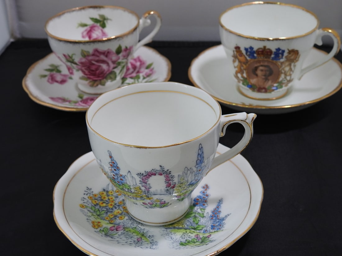 Set of 3 Vintage Bone China Teacup and Saucers: Set of three vintage bone china teacups and saucers with matching patterns; see photos for individual designs. Measured as packed. Approx. 10 x 6 x 6 in.