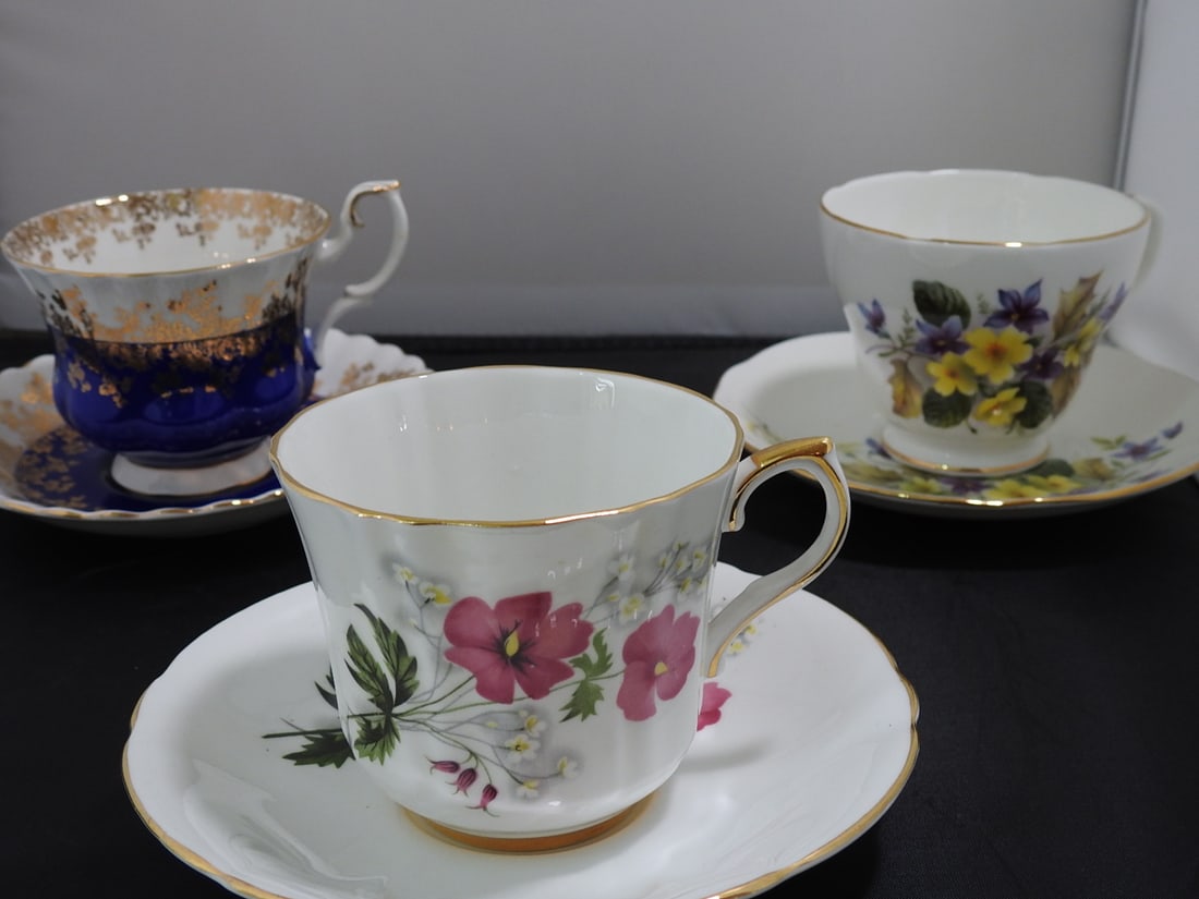 Set of 3 Vintage Bone China Teacup and Saucers: Set of three vintage bone china teacups and saucers with matching patterns; see photos for individual designs. Measured as packed. Approx. 10 x 6 x 6 in.