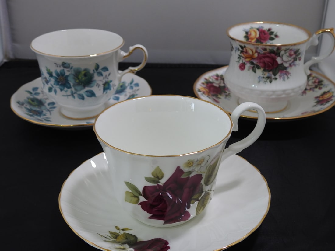 Set of 3 Vintage Bone China Teacup and Saucers: Set of three vintage bone china teacups and saucers with matching patterns; see photos for individual designs. Measured as packed. Approx. 10 x 6 x 6 in.