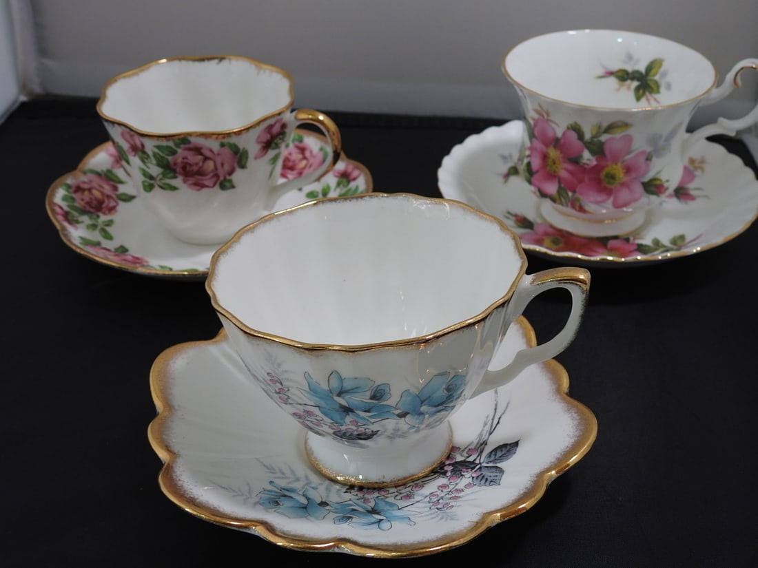Set of 3 Vintage Bone China Teacup and Saucers: Set of three vintage bone china teacups and saucers with matching patterns; see photos for individual designs. Measured as packed. Approx. 10 x 6 x 6 in.