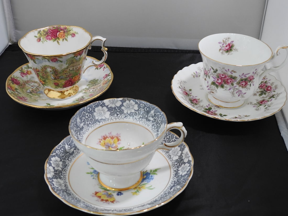 Set of 3 Vintage Bone China Teacup and Saucers: Set of three vintage bone china teacups and saucers with matching patterns; see photos for individual designs. Measured as packed. Approx. 10 x 6 x 6 in.