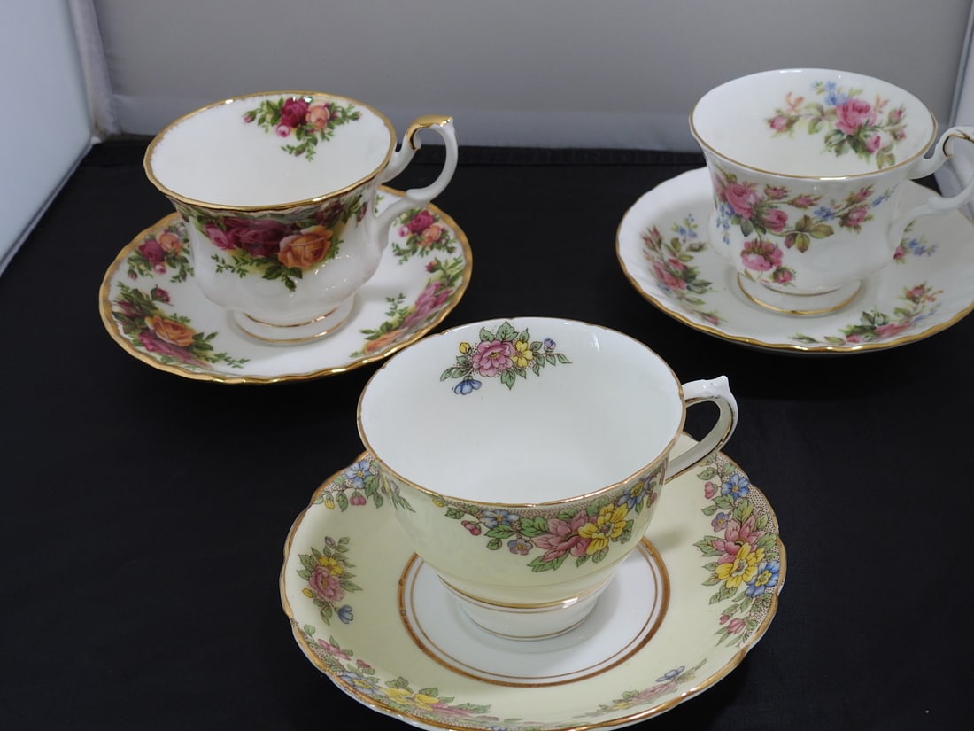 Set of 3 Vintage Bone China Teacup and Saucers: Set of three vintage bone china teacups and saucers with matching patterns; see photos for individual designs. Measured as packed. Approx. 10 x 6 x 6 in.