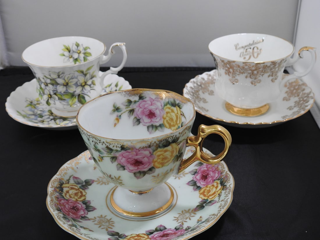 Set of 3 Vintage Bone China Teacup and Saucers: Set of three vintage bone china teacups and saucers with matching patterns; see photos for individual designs. Measured as packed. Approx. 10 x 6 x 6 in.