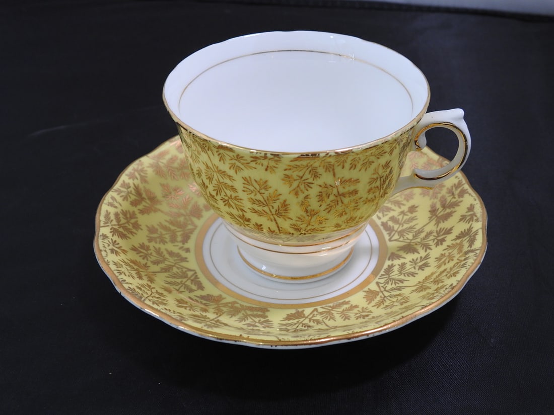 Vintage Bone China Teacup and Saucer: Vintage bone china teacup and saucer with matching pattern; see photos for design details. Measured as packed. Approx. 5 x 6 x 6 in.