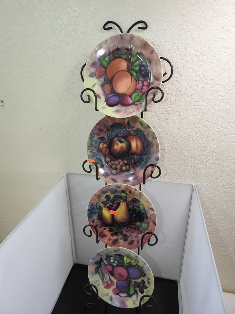 Set of 4 Fruit Plates with Rack: Set of 4 Fruit Plates with Rack. Elite Decor - Artist Signed by Fiorilli Approx. 34 x 10 x 3 in.